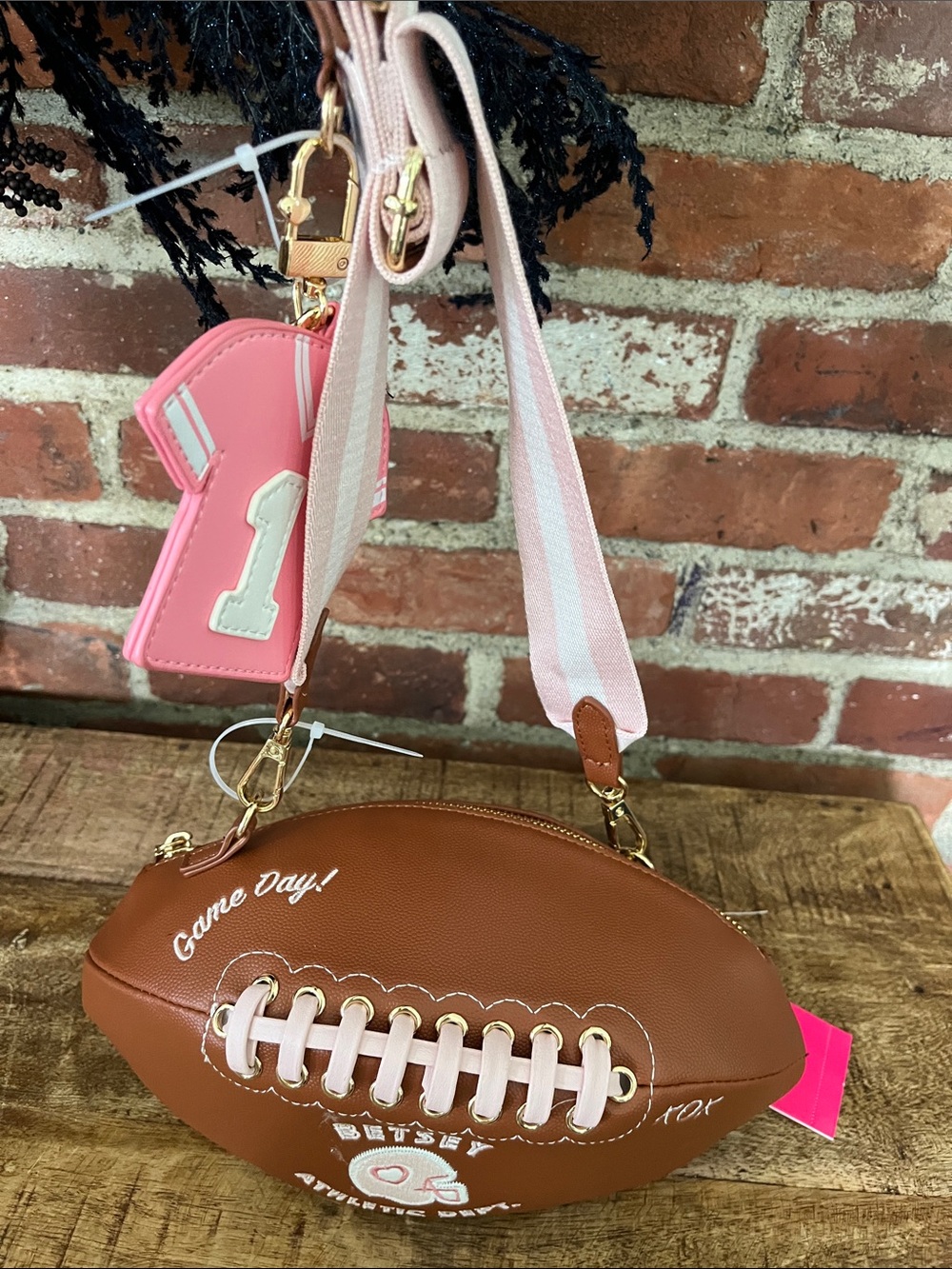 Betsey Johnson Brown Football Crossbody Bag with Pink Strap & Charm